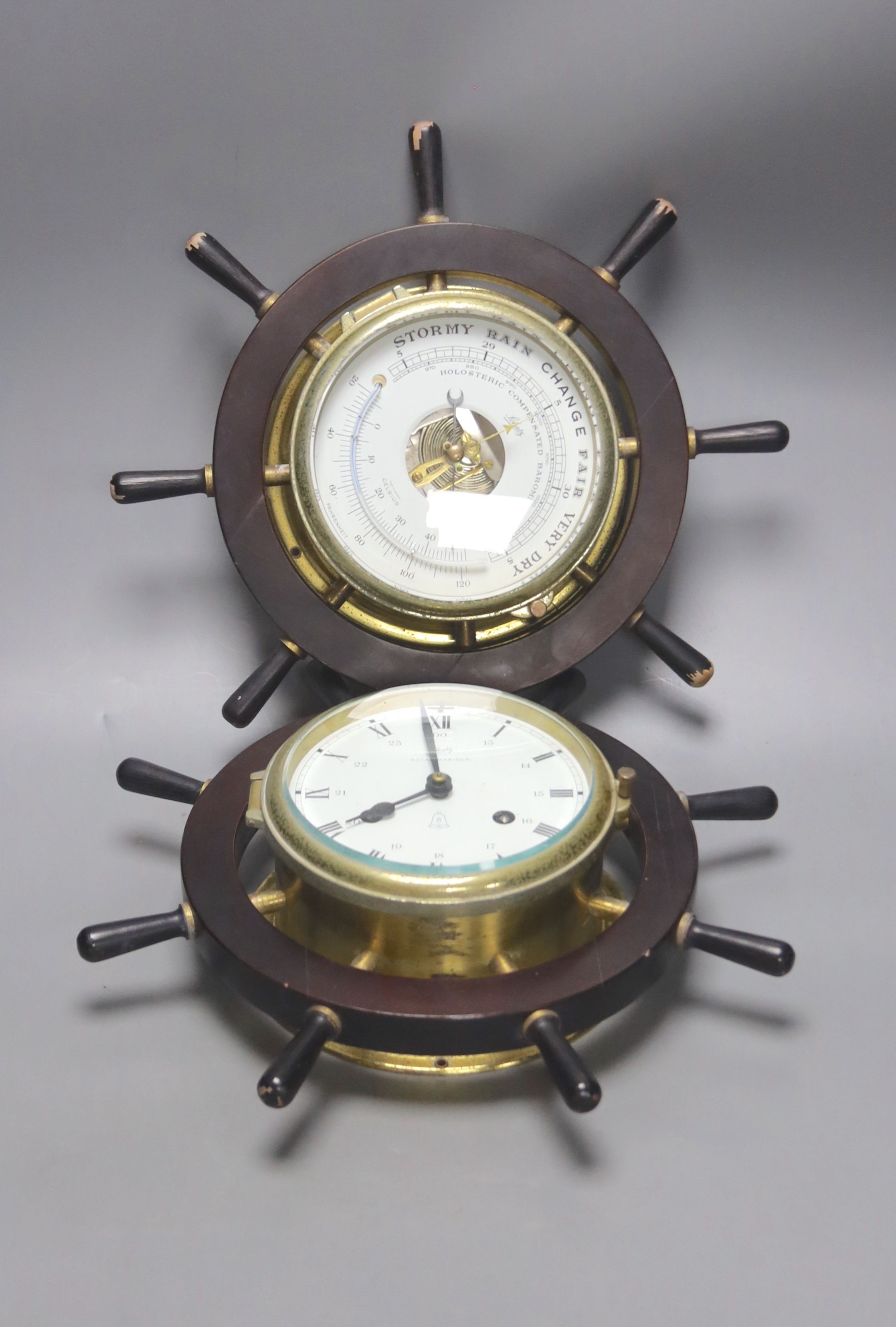 A pair of Schatz marine style wall hanging instruments: a clock and a holosteric compensated barometer, dials 13cm